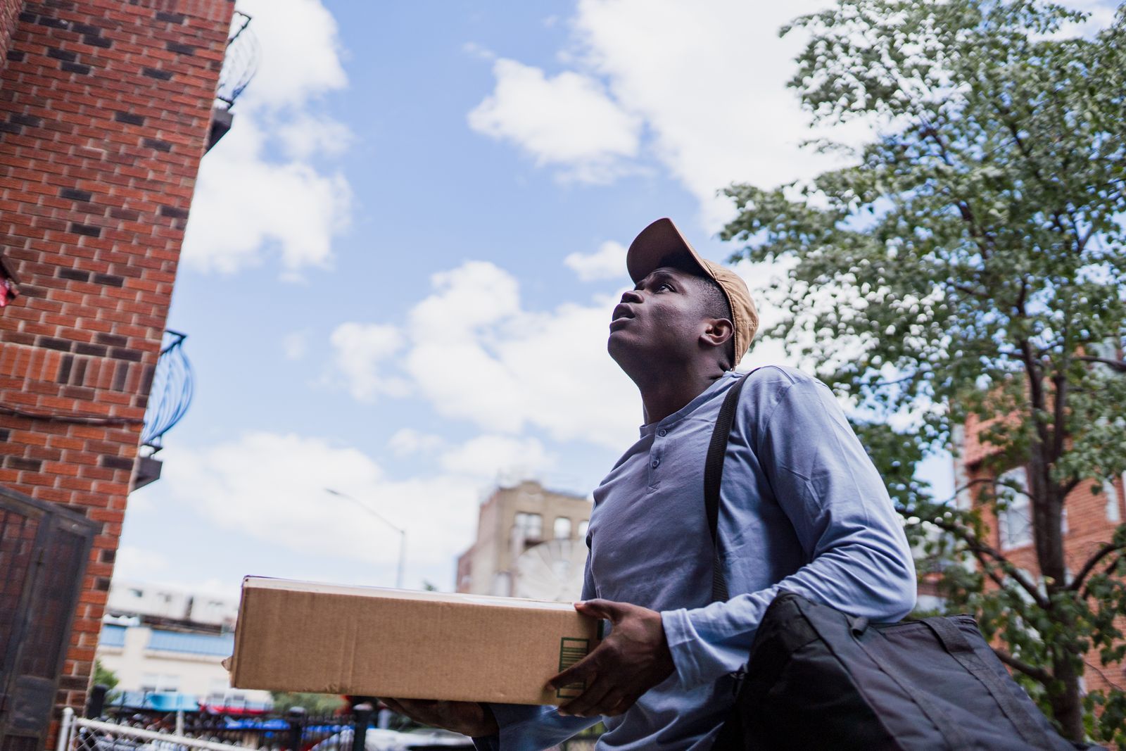Courier carrying a parcel for cross-border delivery